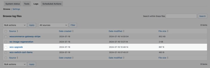 The wcs-upgrade log appears on the list of WooCommerce logs