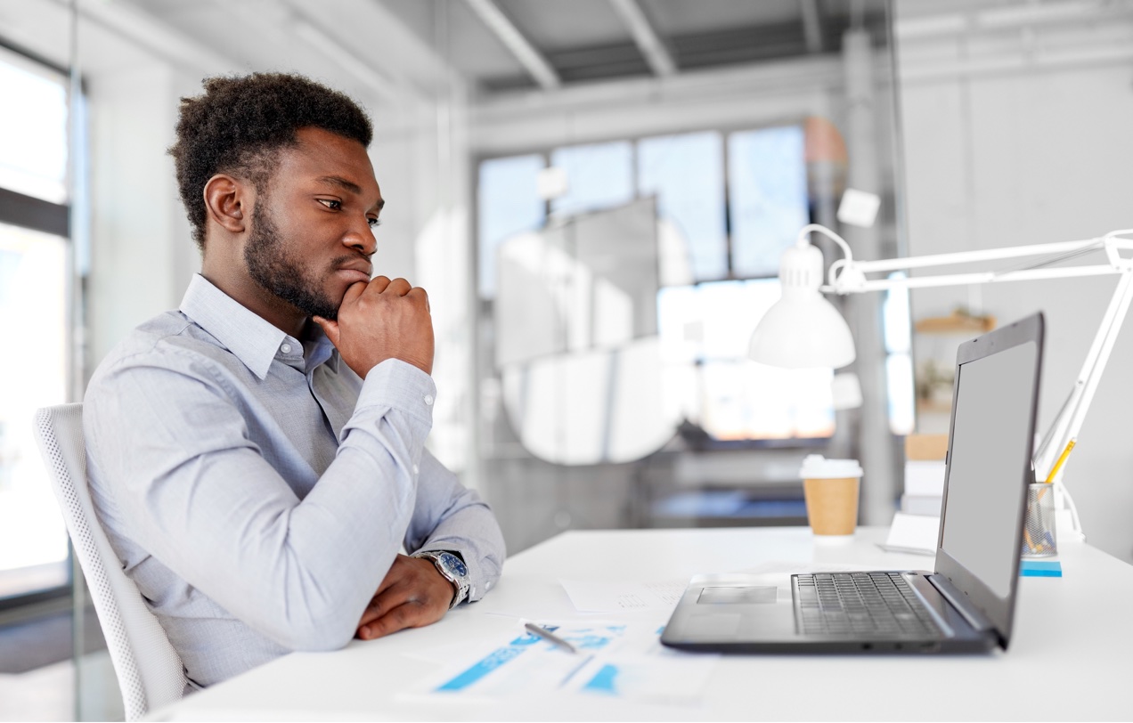 Man using accounting platform software on a laptop computer.