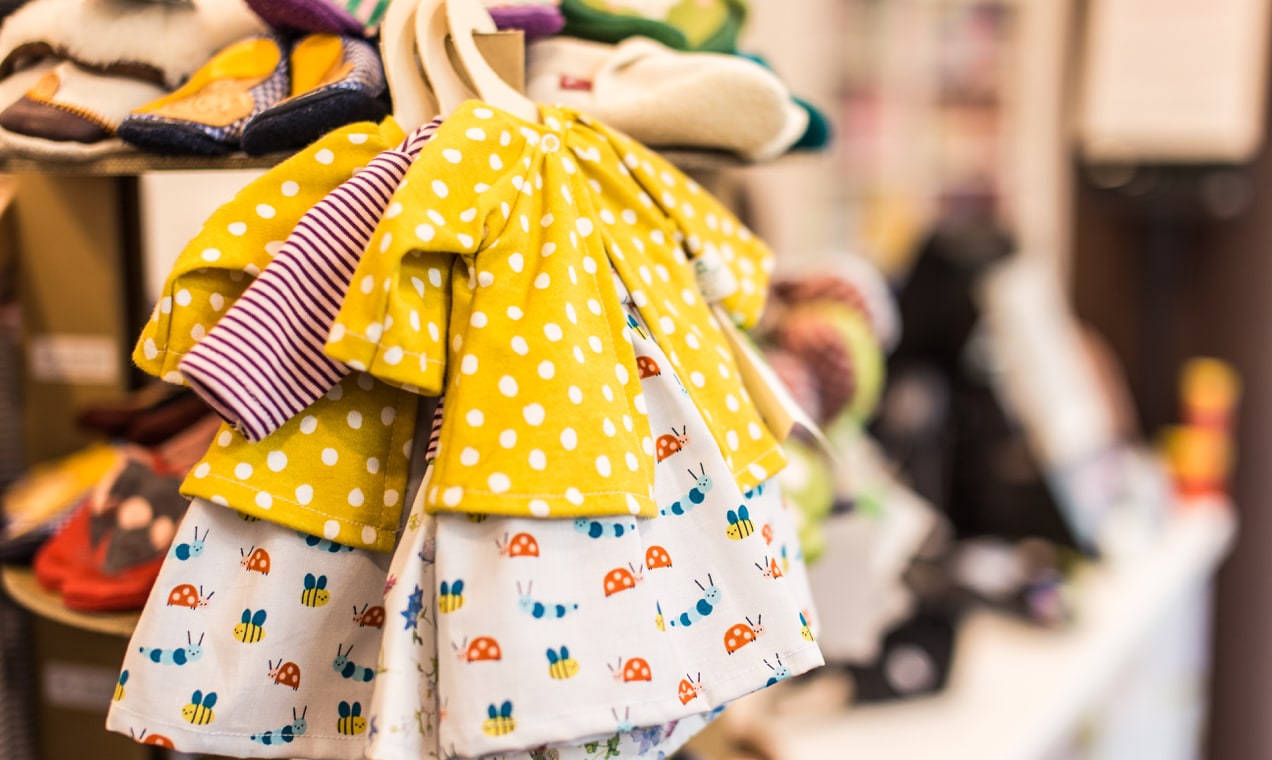 children's clothes hanging on a rack