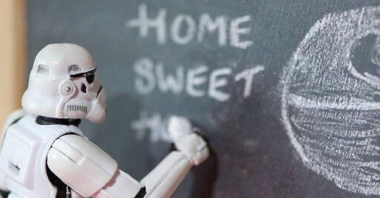 Star Wars storm trooper figurine writing on a chalkboard.