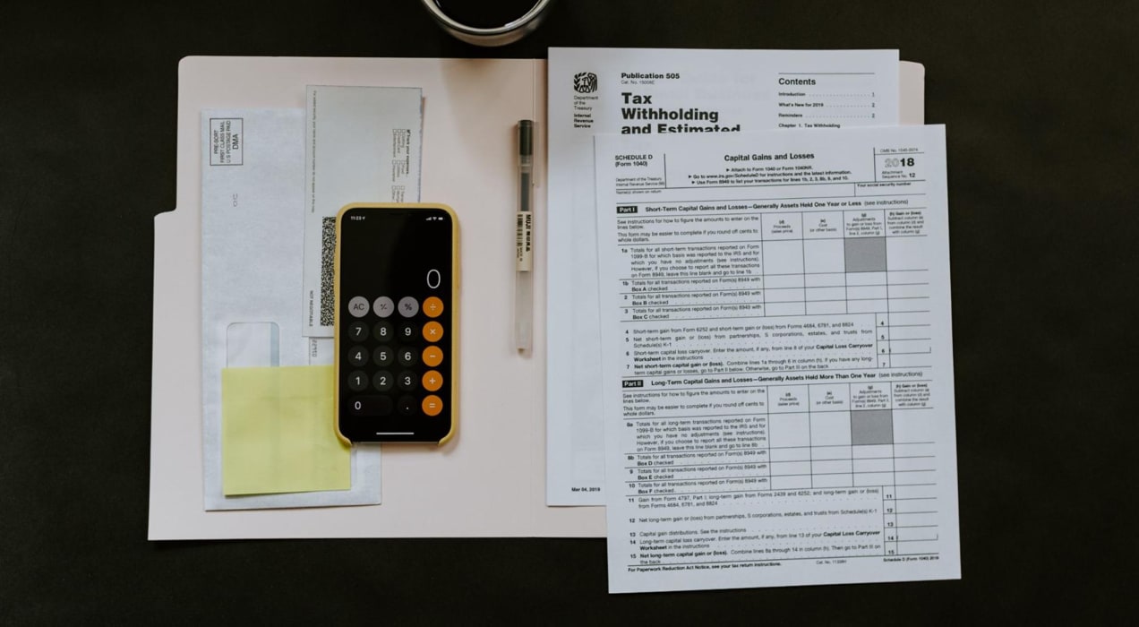 stack of tax documents on a table