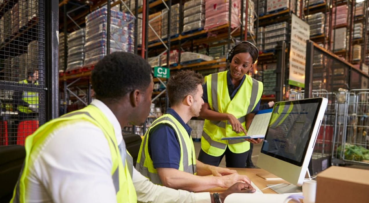 team working on inventory management in a warehouse