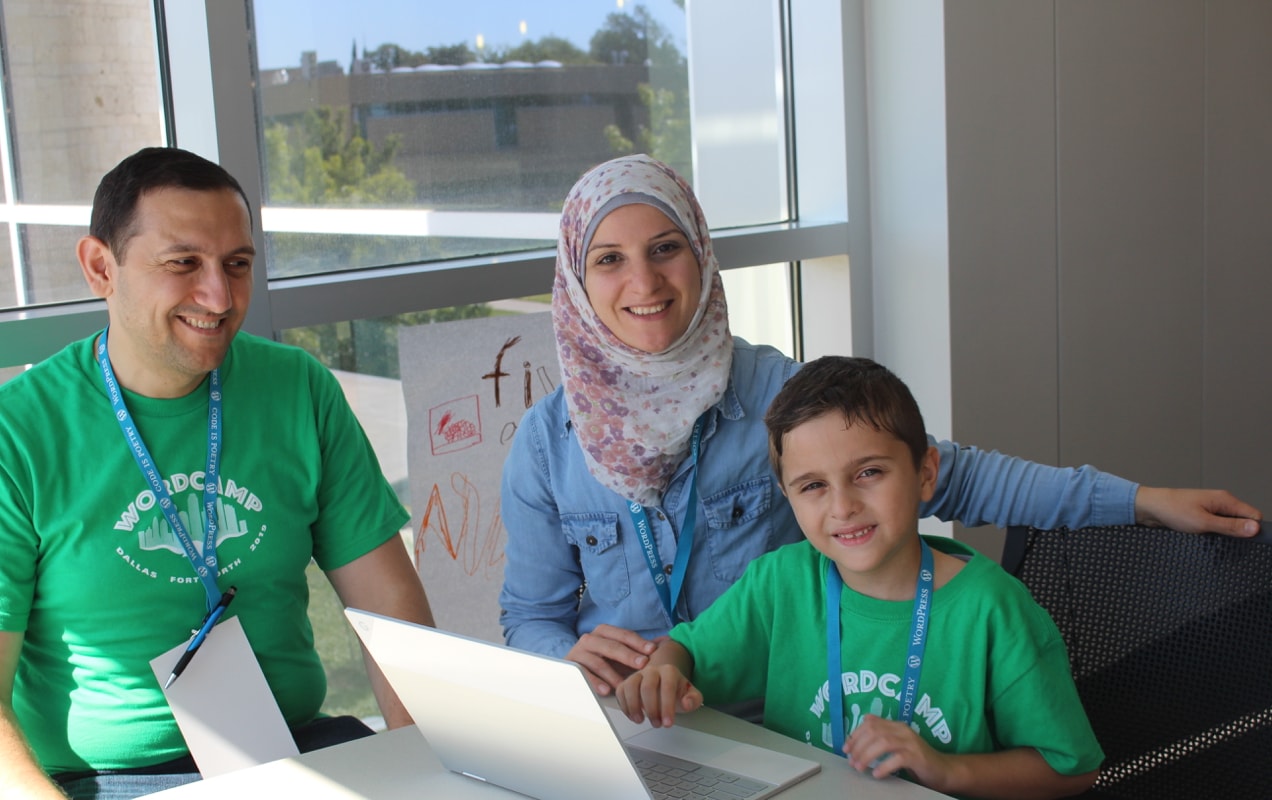 KidsCamp participants working on a website