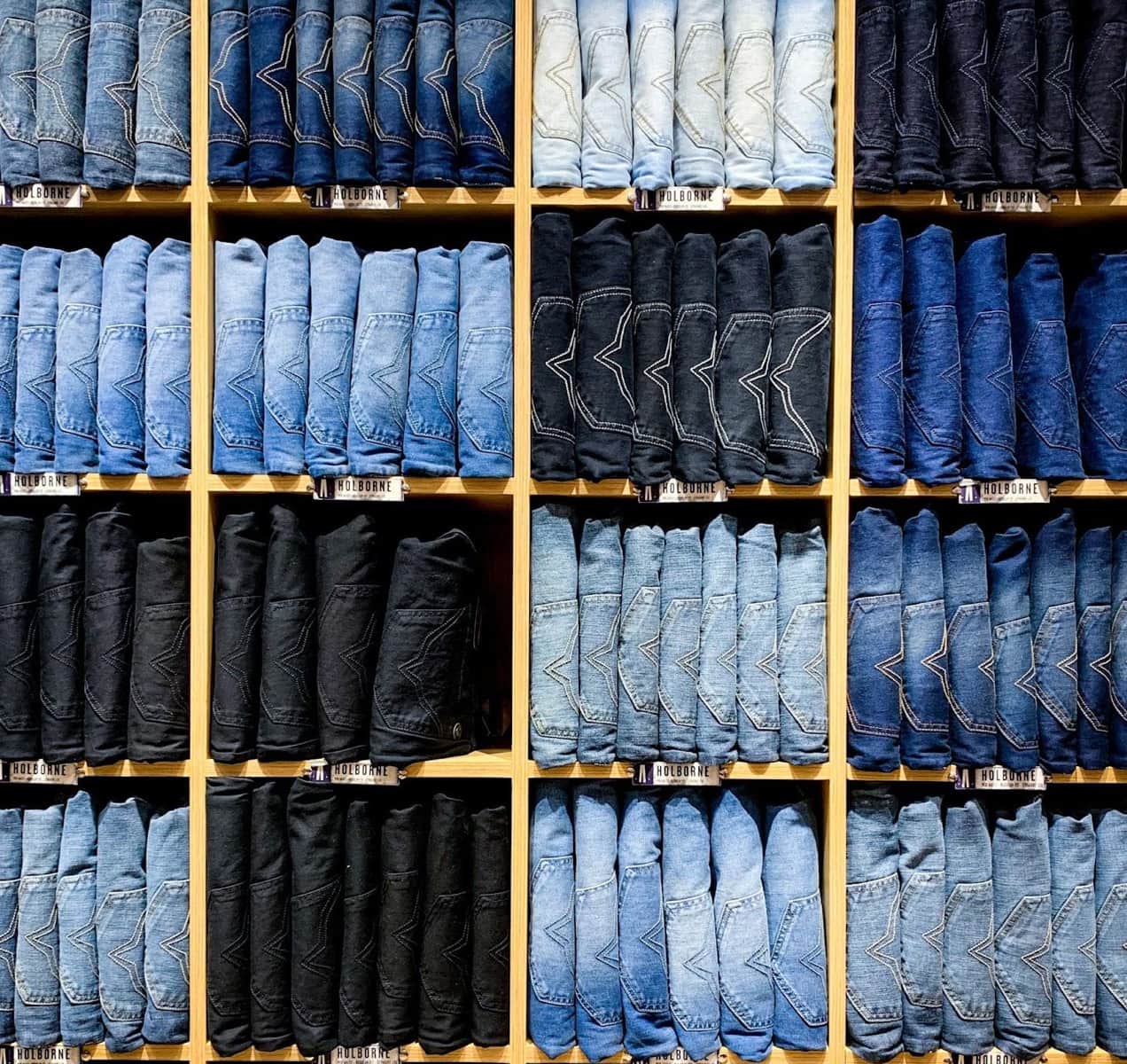 shelves full of jeans in different shades