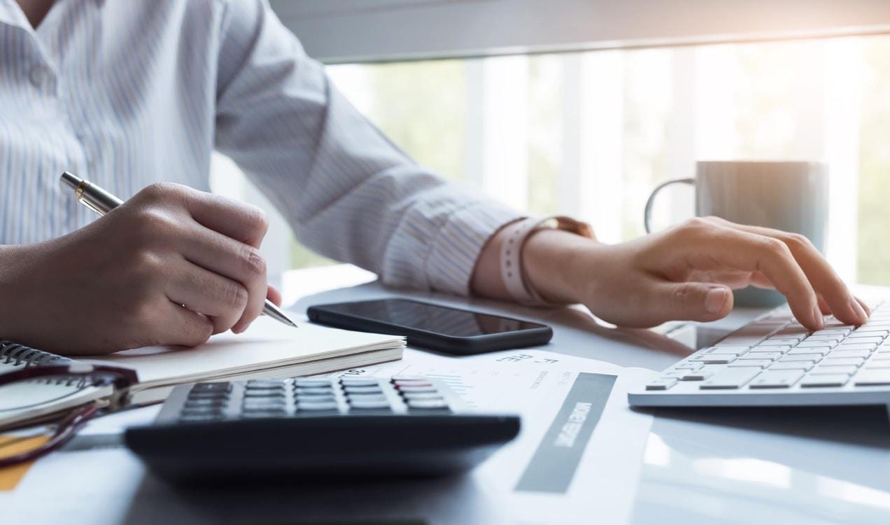 accountant working with a calculator