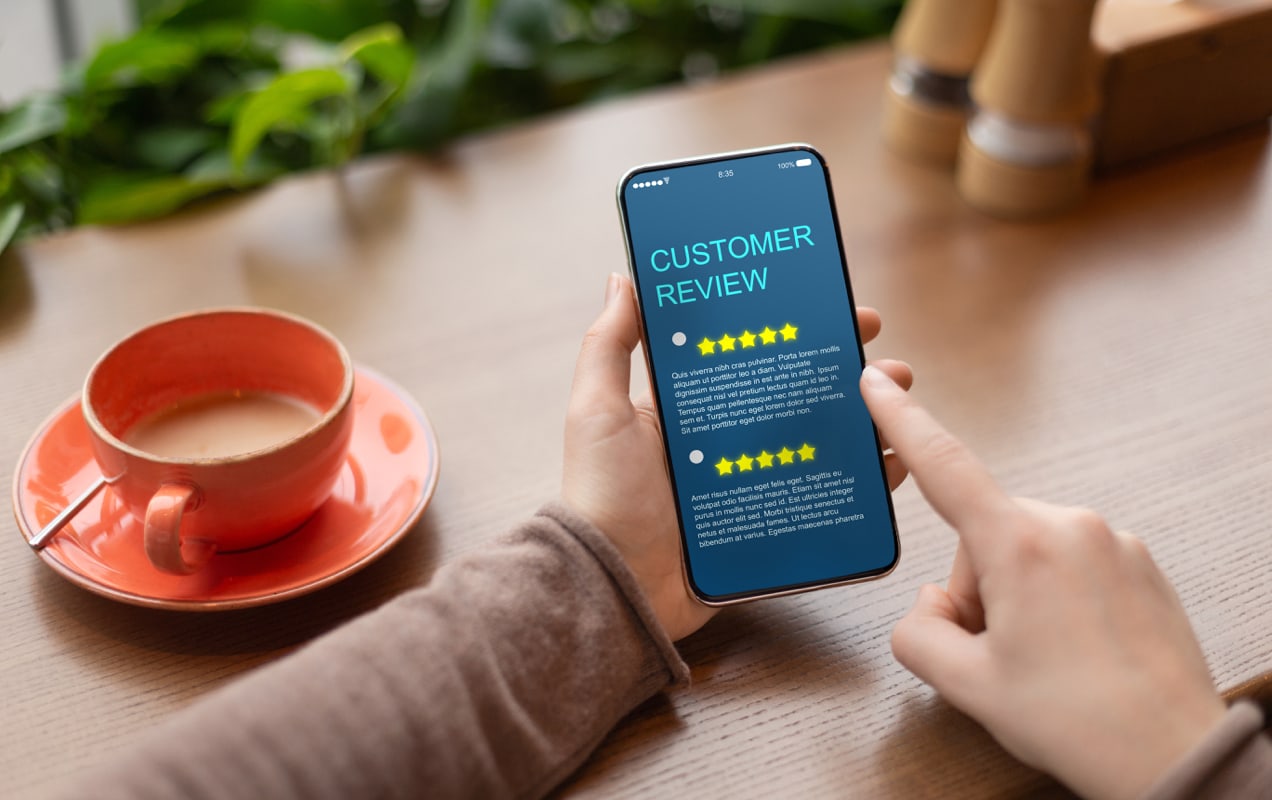 customer leaving a review on a mobile phone