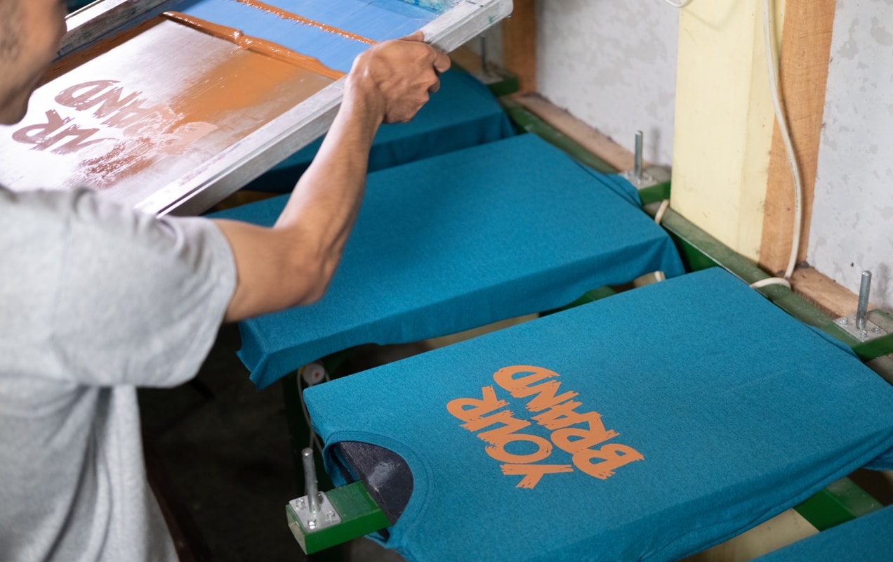 printing a blue t-shirt with an orange design