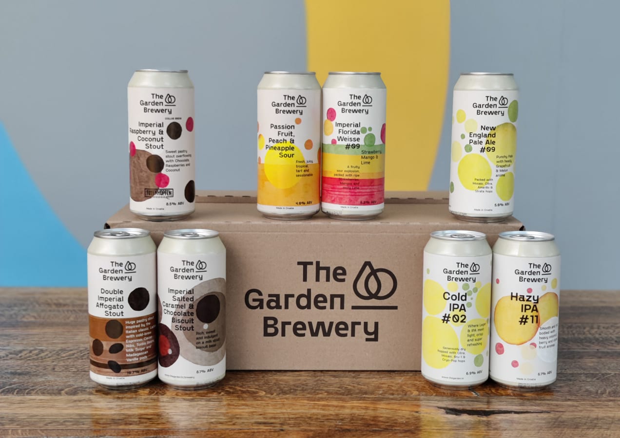 colorful cans of beer stacked on a table