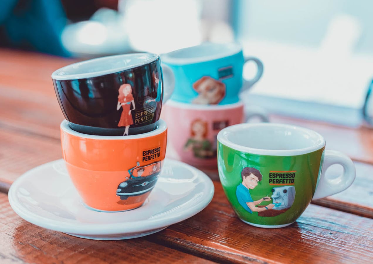 colorful coffee cups stacked on a table