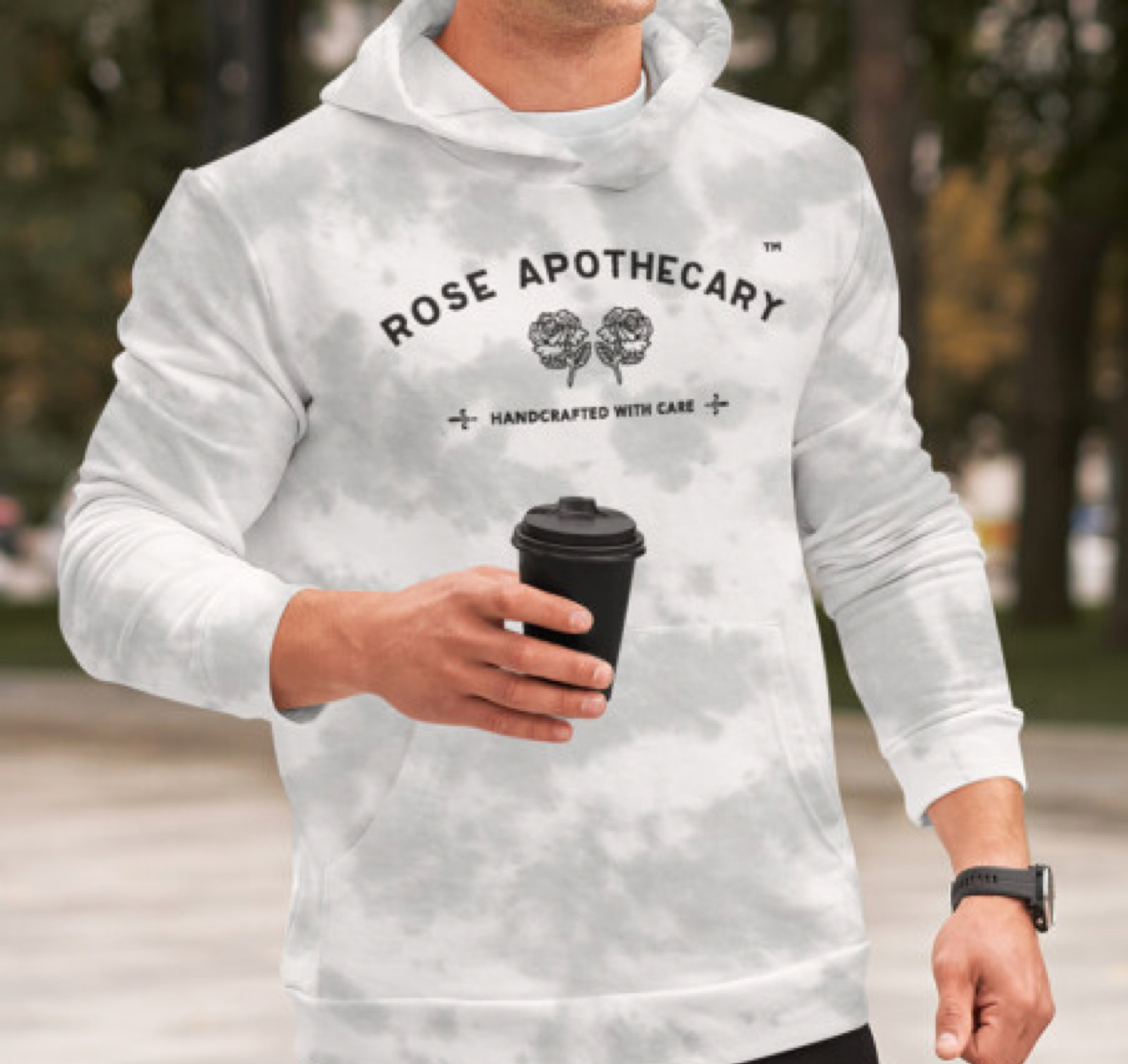 man wearing a grey Rose Apothecary sweatshirt