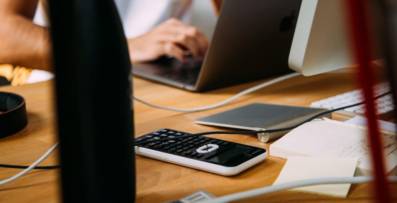 person working on multiple devices