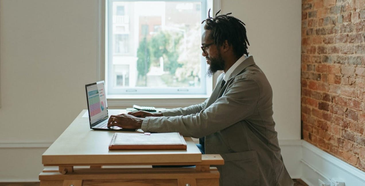 man working on a laptop compter