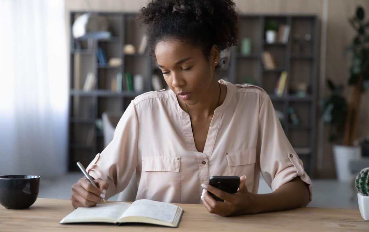 woman writing in a notebook