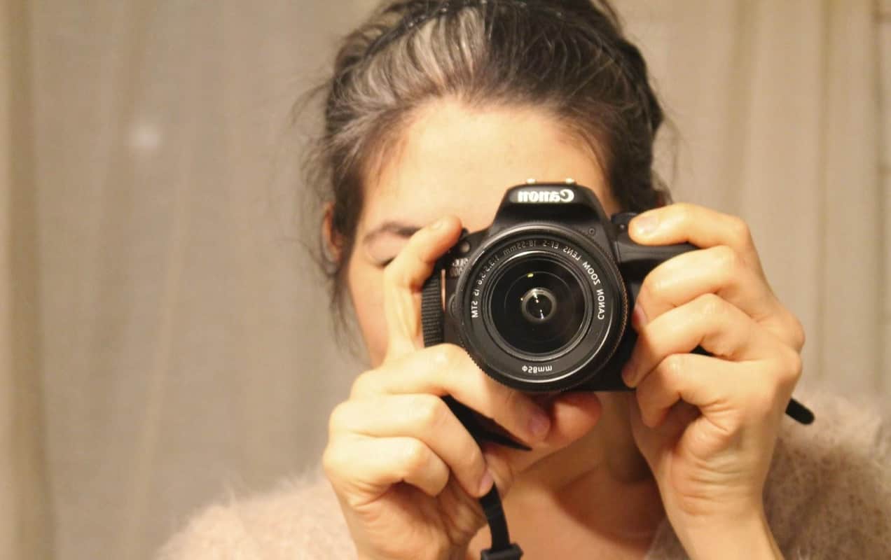 photographer taking a picture with a camera