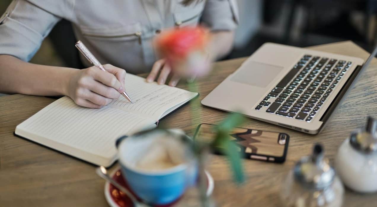 business owner writing in a notebook