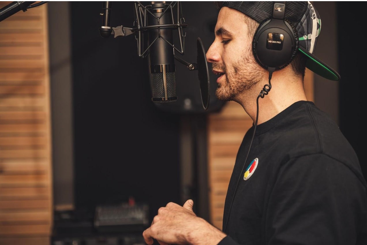 man recording voiceover in a studio