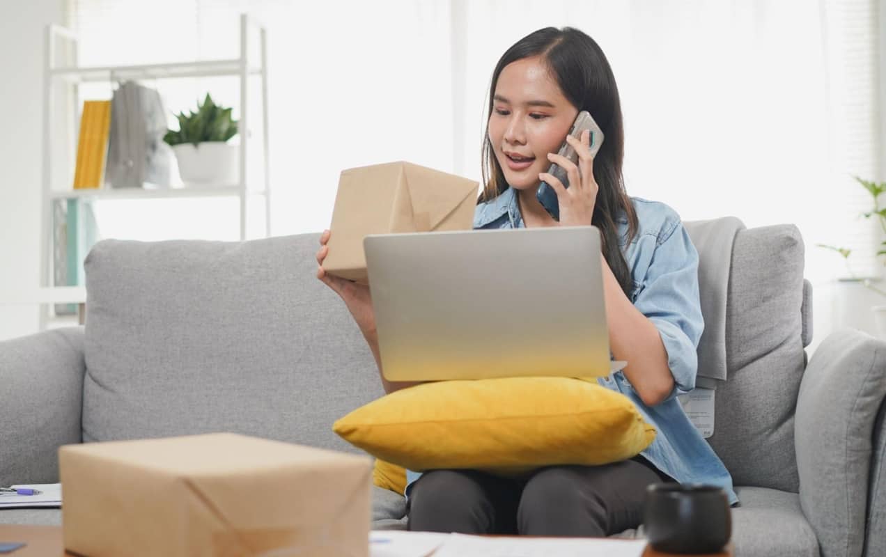 woman talking to customer service on the phone