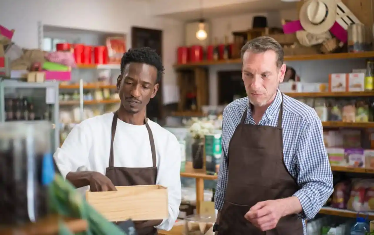 two men packing orders in a store