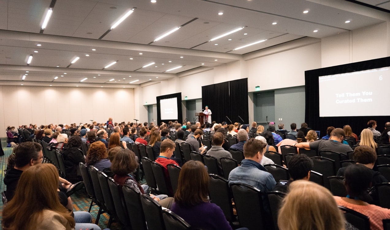 crowd of people listening to a speaker at WordCamp U.S.