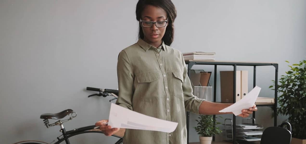 business owner reviewing papers in her office