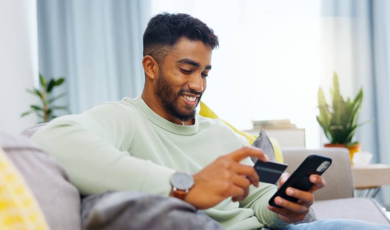 man checking out using his phone