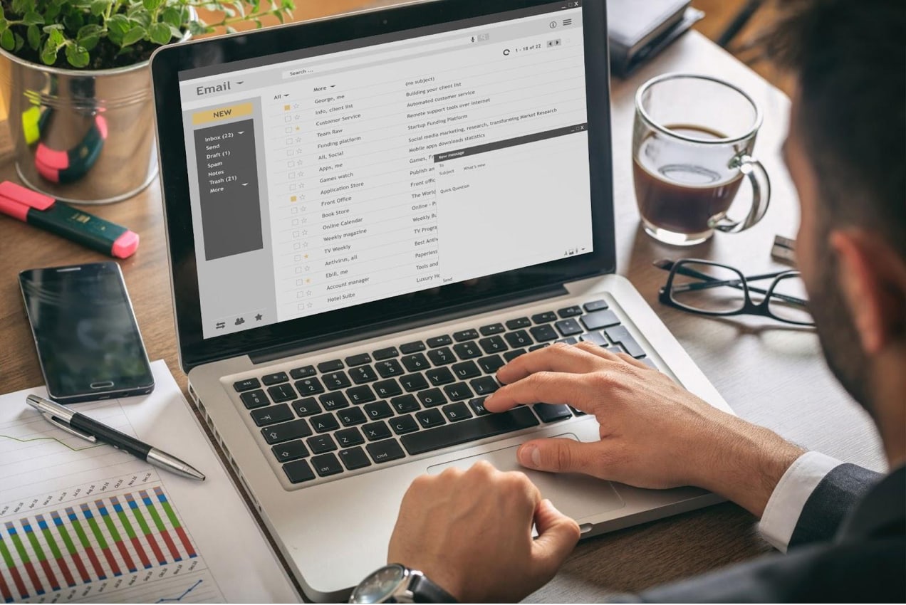 someone checking their email on a laptop