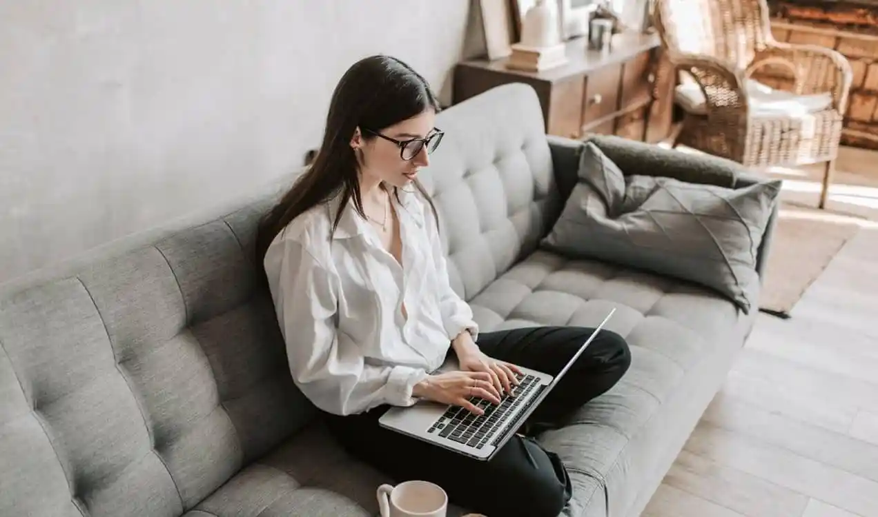 woman working on her computer in a living room