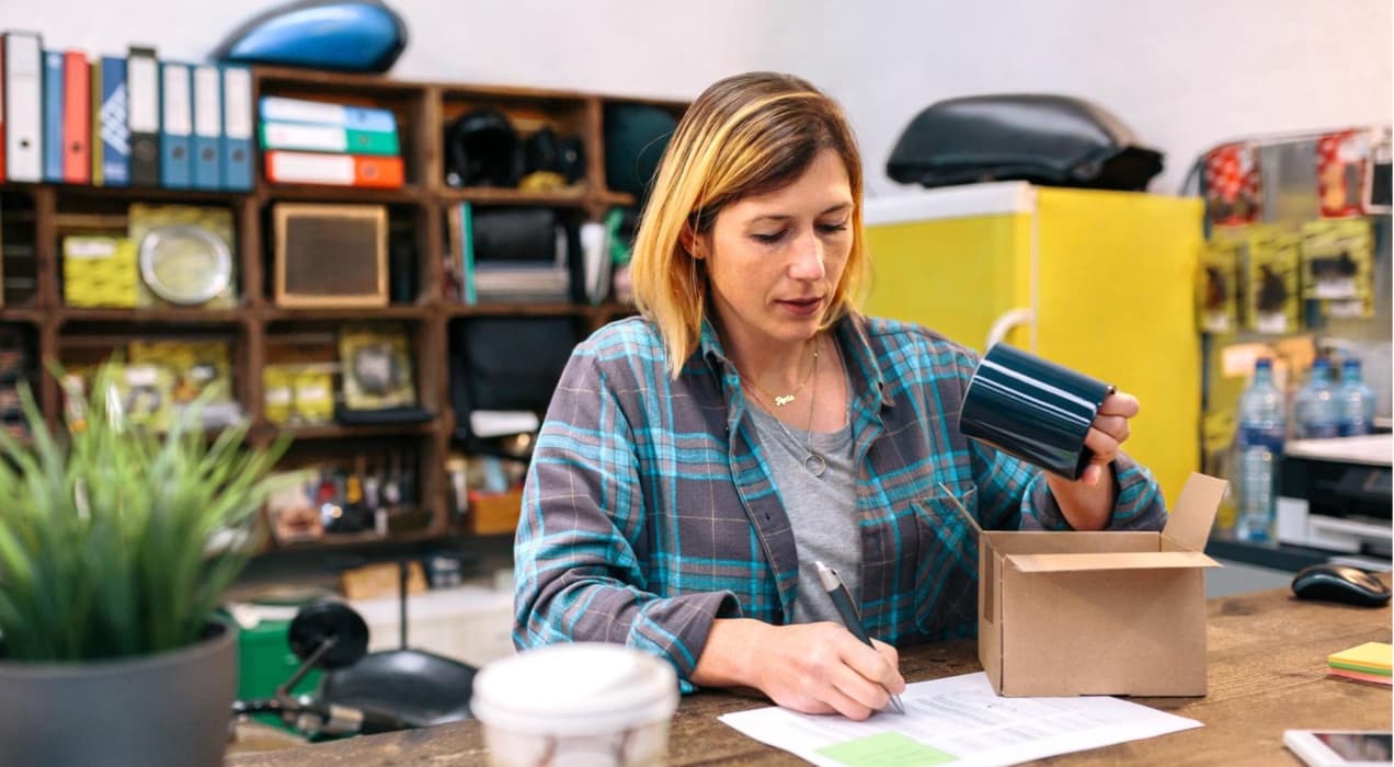 woman packing up an item