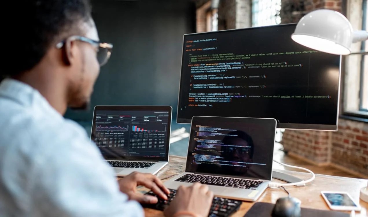 developer working on multiple screens