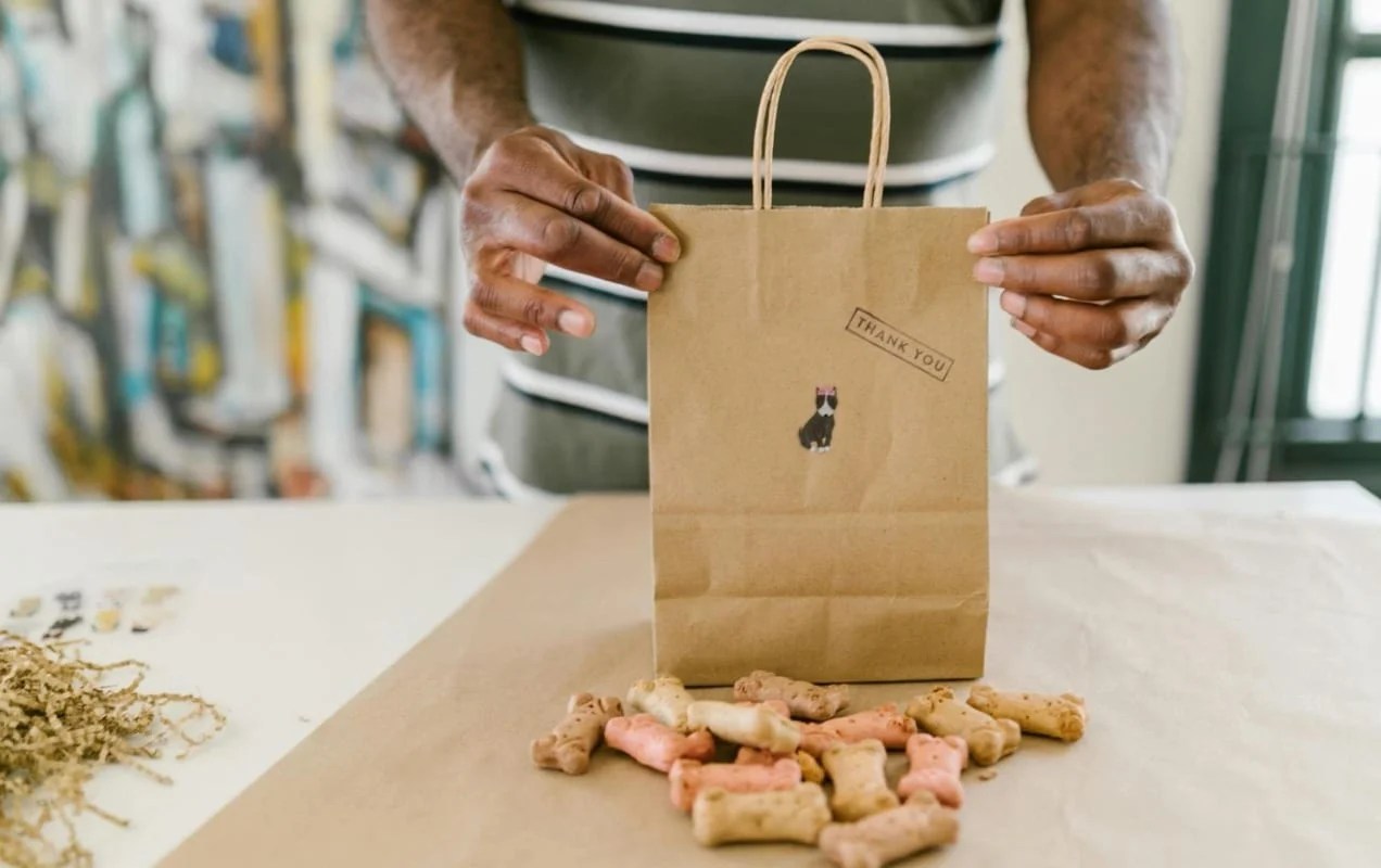 bag with a thank you note next to dog treats