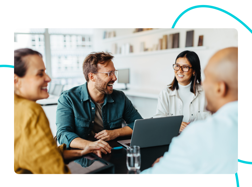 A group of developers, designers and marketers who work in an agency sitting around a table.