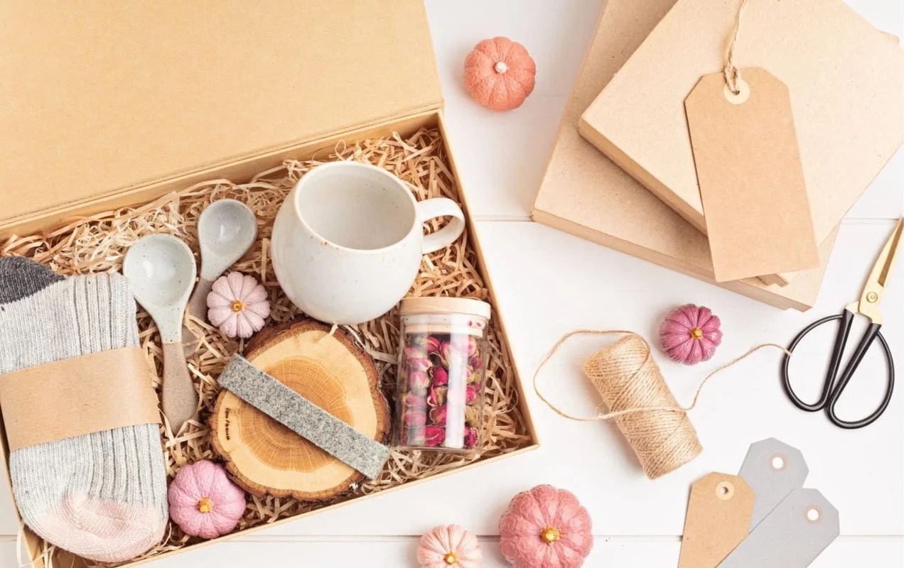 box packaged with socks, candles, and related items