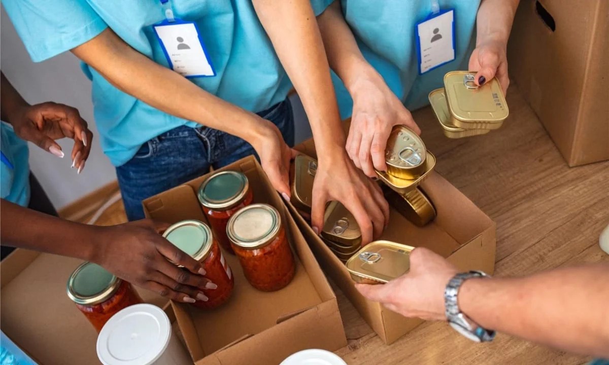 people loading boxes of food for charity